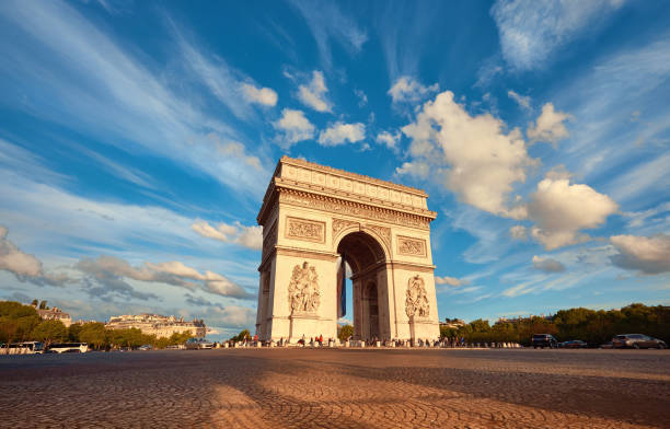 istock Arc de Triumph in Paris with beautiful clouds behind in Fall 873803354