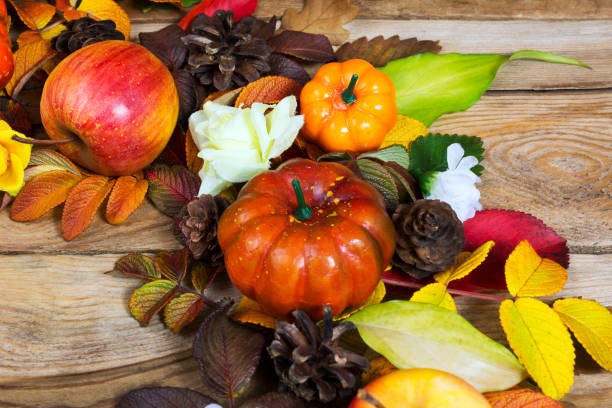 istock Thanksgiving wreath with pumpkins, apple and cones 873821572