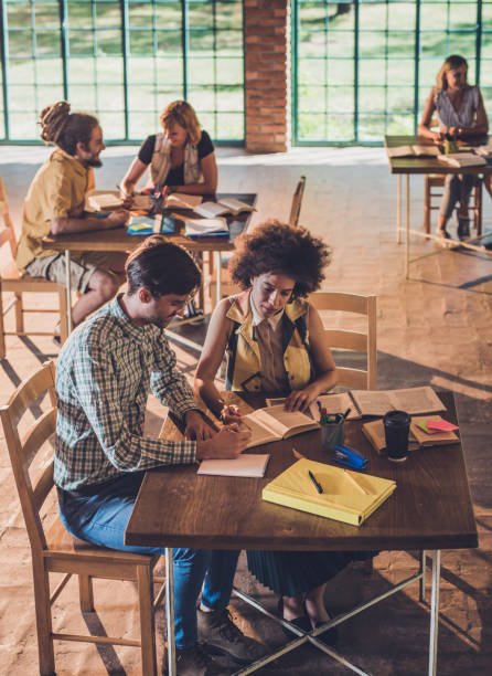 istock University students studying together for upcoming exams. 873821658