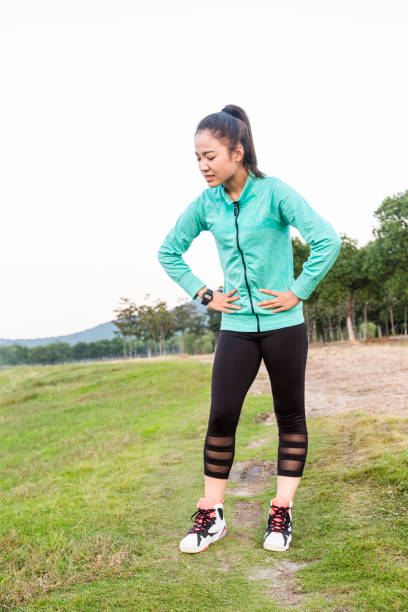 istock young woman resting with a painful expression 873833314