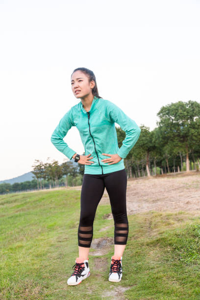 istock young woman resting with a painful expression 873833316