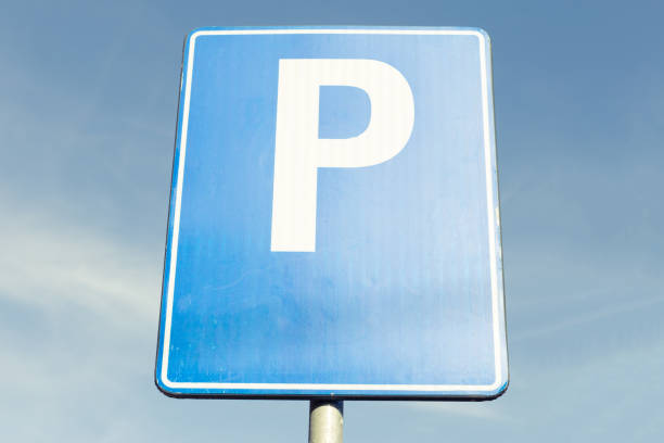 istock Parking ahead road sign on blue metal plate 873834148