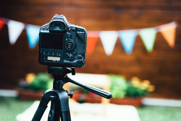 istock Picture of digital camera placed on tripod 873834538