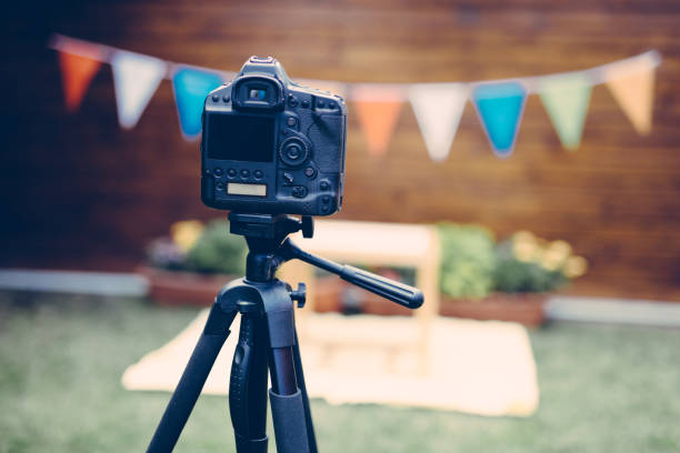 istock Picture of digital camera placed on tripod 873834594