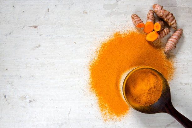 Turmeric Roots and Powder stock photo