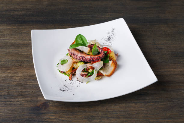istock Salad with octopus and vegetables top view 873841862