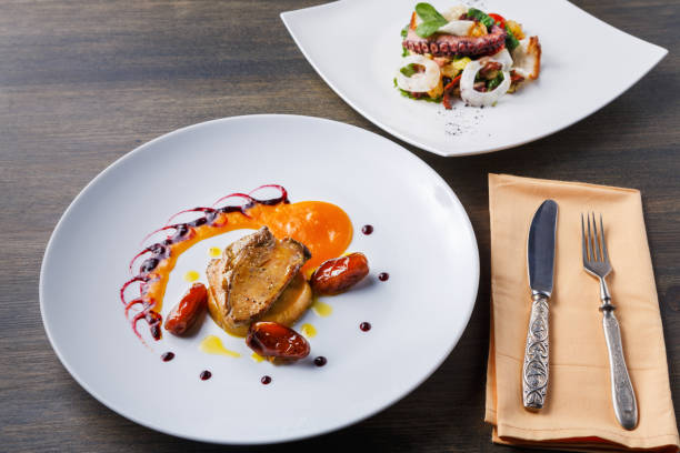 istock Roasted goose liver with date fruit and apple 873842662