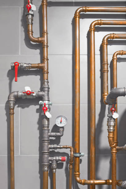 istock Water heating system with copper pipes in boiler room 873853102