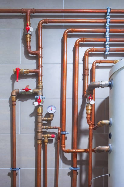 istock Water heating system with copper pipes in boiler room 873853114