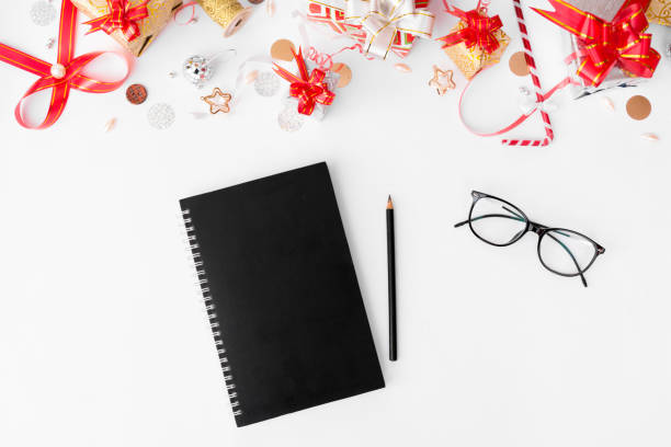 istock diary christmas time mock up, red with white background christmas decor, flat lay top view. 873853996