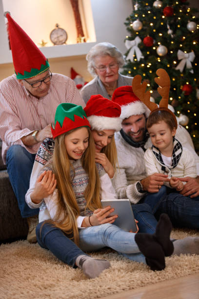 istock family enjoying their holiday time together using tablet 873858340