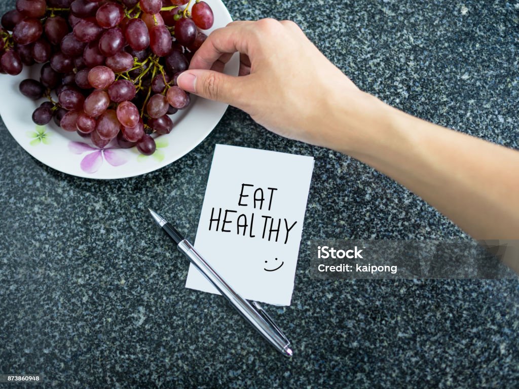 Eating Healthy Note Eat Healthy Text On Paper Note With Hand Picking Grape Stock Photo ...