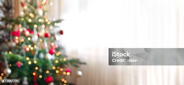 Out Of Focus Holiday Background With Christmas Tree Stock Photo - Download Image Now