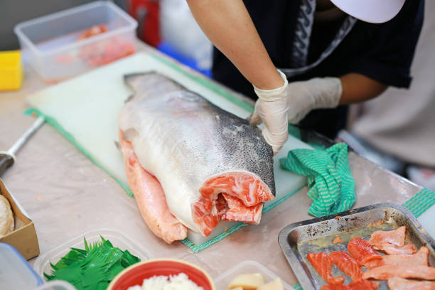 istock The chef cuts the salmon on a cutting board. Ingredient for seafood dish. 873861806