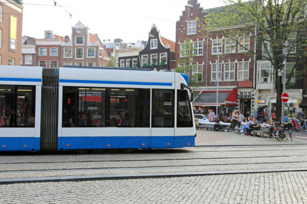 istock along the public tramway to the large Amsterdam square 873864526