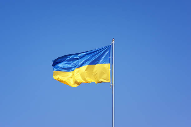 istock Ukrainian flag on blue sky backgroud 873865060