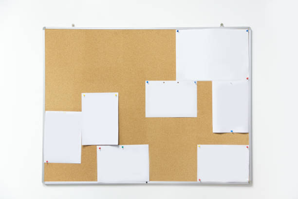 istock Board with busy paper post on white wall in office 873865732