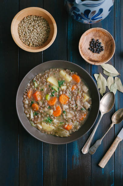 lentil soup on table - cooked vertical high angle view lentil imagens e fotografias de stock