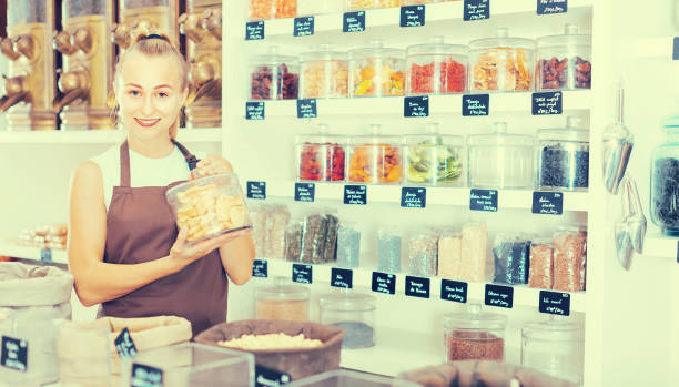 istock Female is selling dried Poma 873874074