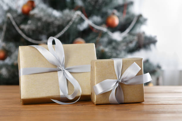 istock Christmas present on decorated tree background, holiday concept 873874158