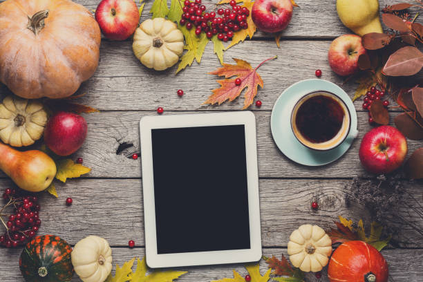 istock Seasonal background with autumn harvest and tablet 873882244