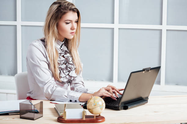 istock business woman working in the office 873883030