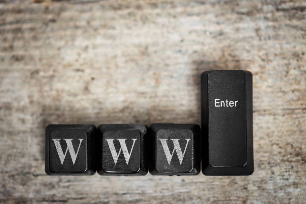 keys on a wooden table with the word www, concept world wide web, internet