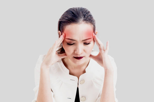 istock Woman headache and holding head on gray background 873886882