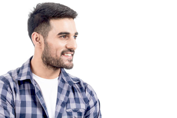 istock Portrait of handsome man smiling with copy space isolated on white background 873886926
