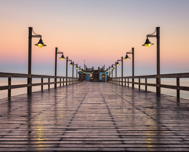 Wet Swakopmund Pier at Sunrise, Namibia, Africa Wet Swakopmund Pier at Sunrise, Namibia, Africa swakopmund photos stock pictures, royalty-free photos & images