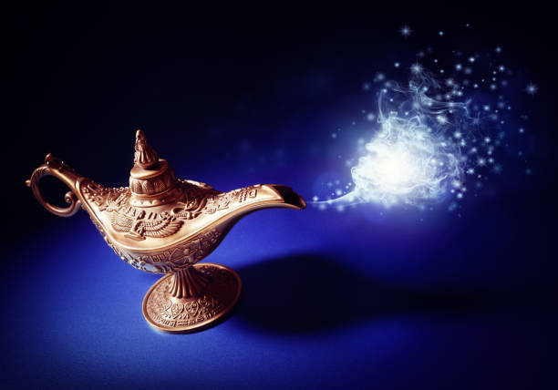 Magic Aladdins Genie lamp Magic lamp from the story of Aladdin with Genie appearing in blue smoke concept for wishing, luck and magic magic lamp photos stock pictures, royalty-free photos & images