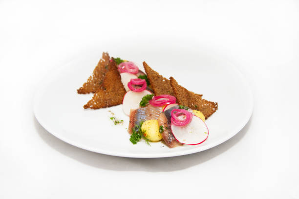 istock Plate of omul fish with bread and onion on white 873894982