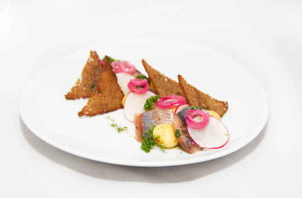istock Plate of omul fish with bread and onion on white 873895020