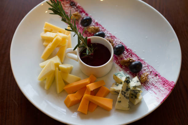 istock White plate with a set of various cheese 873895308
