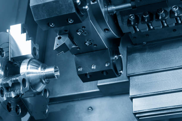 istock CNC lathe machine (Turning machine) cutting the metal  cone shape 873895448