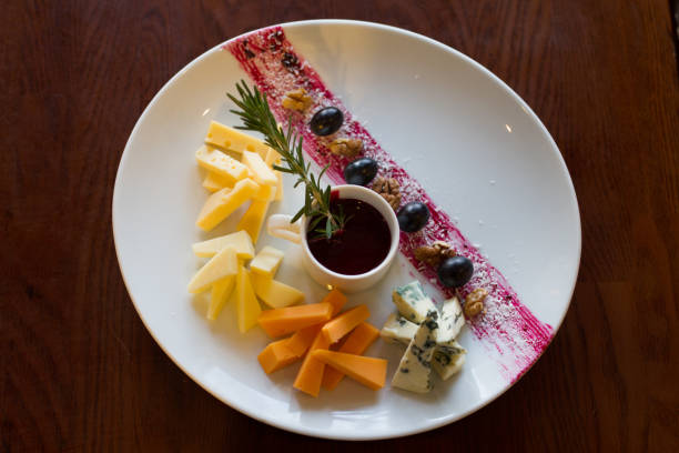 istock White plate with a set of various cheese 873895492