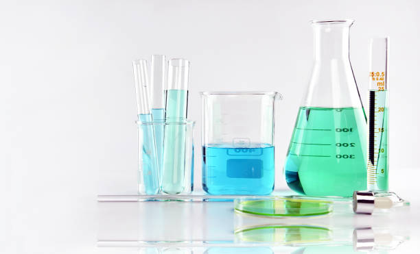 istock Scientific laboratory experimental glassware with clear solution, Symbolic of science research and development. 873899542