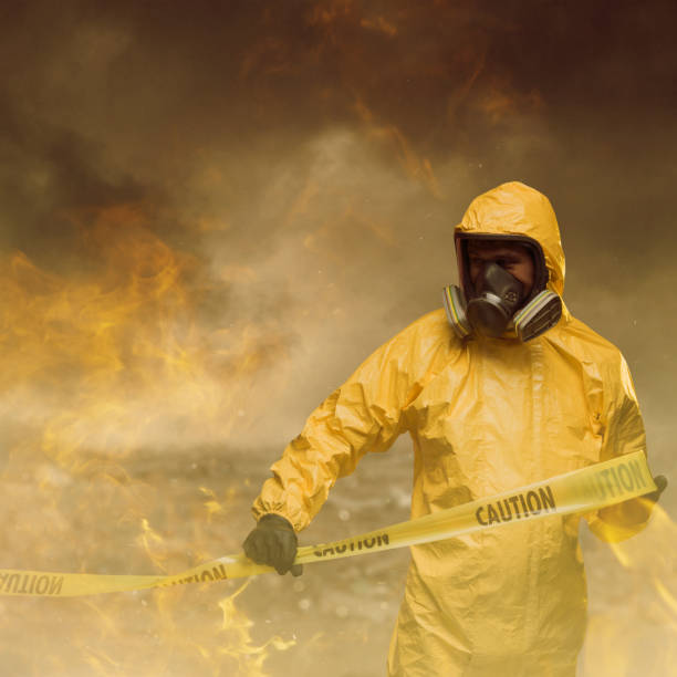 Danger zone Man wearing protective suit with caution tape. Danger zone concept. biochemical weapon photos stock pictures, royalty-free photos & images