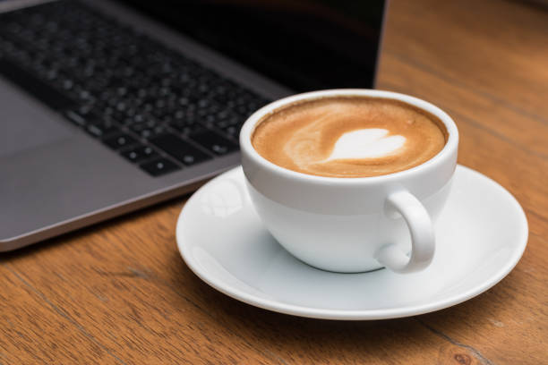 istock late art hot coffee on wooden floor 873902590