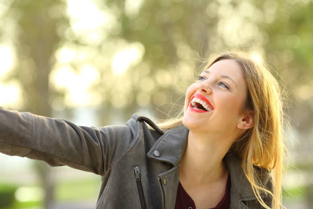 istock Candid girl happy in a park 873904218