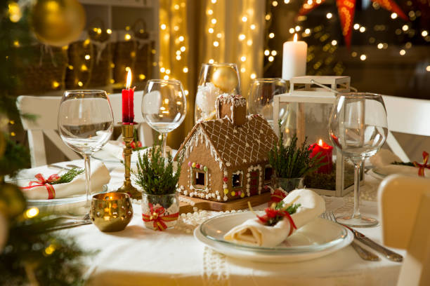 Beautiful served table with Christmas decorations, candles and lanterns stock photo