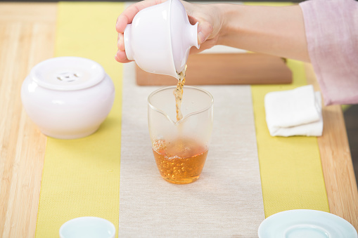 Chinese female tea ceremony, serving tea, tea setup table