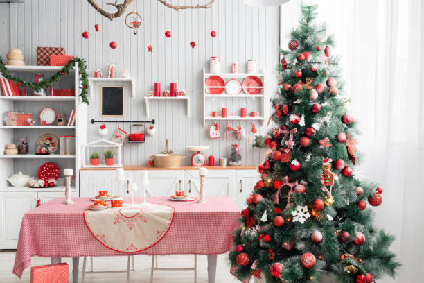 istock Interior light grey kitchen and red christmas decor. Preparing lunch at home on the kitchen concept. 873908178