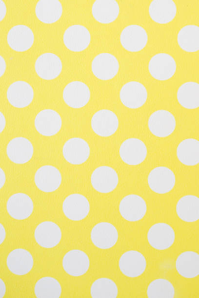 istock Yellow wall and White Polka Dots 873908314