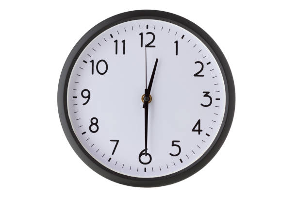 orologio da parete da ufficio rotondo su bianco, le dodici e mezza - clock clock face clock hand isolated foto e immagini stock