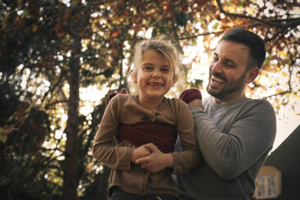 istock Father have play wit daughter , carrying her with scarf. 873912286