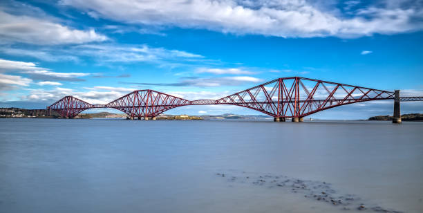 istock Long Exposure of the Forth Bridge in Edinburgh 873916344