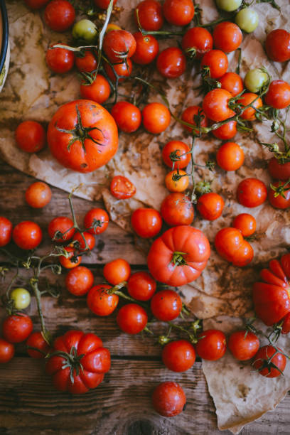 istock Fresh cherry tomatoes on rustic wooden table, Top view with copy space. 873918146
