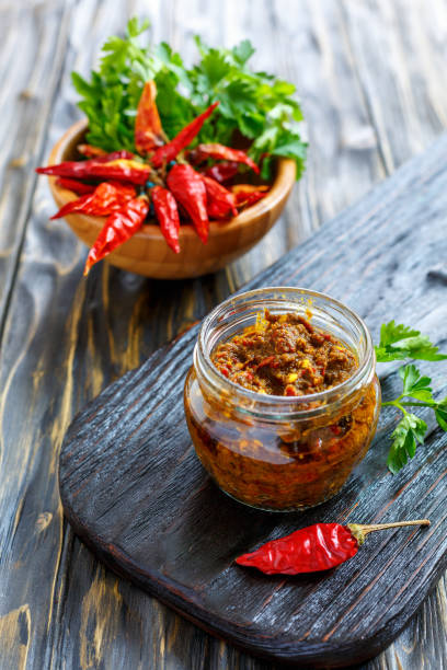 istock Hot pepper sauce in a glass jar. 873920674