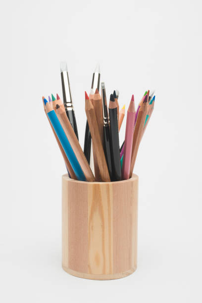 istock Wooden pencil holder with crayons and brushes 873924892